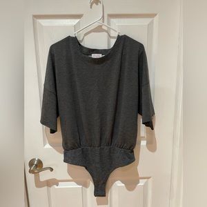 New in package from Pink Lily dark gray short sleeve bodysuit